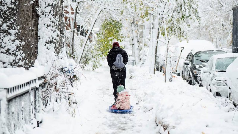 children enjoying snowfall in canada